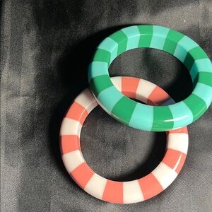 Bangle bracelets in green and pink. Lucite,